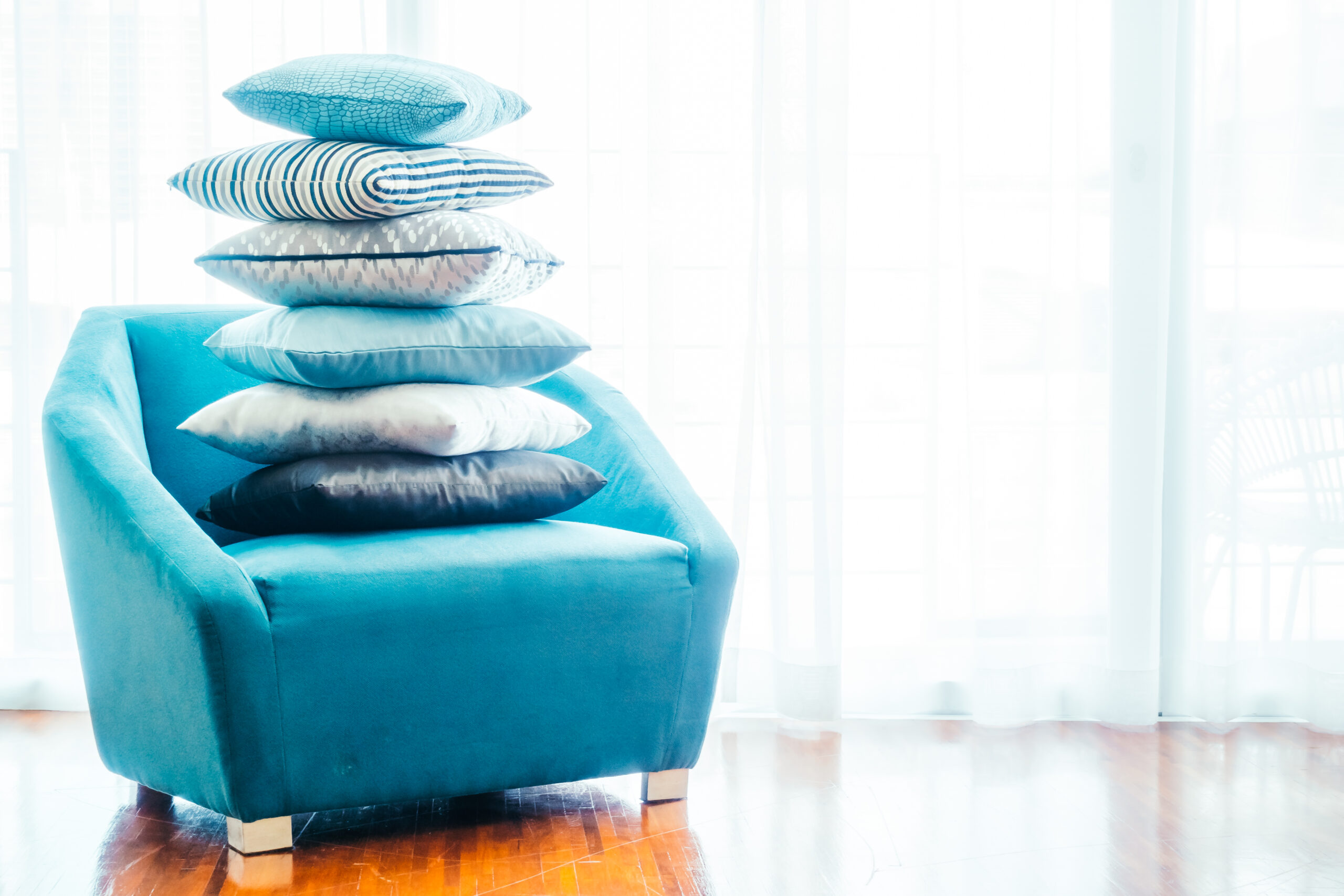 Beautiful luxury pillow on sofa decoration in livingroom interior for background - Vintage Filter